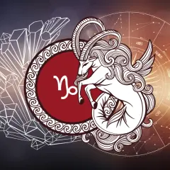Symbol Koziorożca, urodzeni 6 stycznia. Wizerunek mitycznego stworzenia z rogami kozła i ogonem ryby, otoczony kryształami i kołem zodiaku.