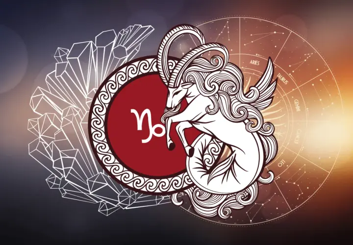 Symbol Koziorożca, urodzeni 6 stycznia. Wizerunek mitycznego stworzenia z rogami kozła i ogonem ryby, otoczony kryształami i kołem zodiaku.