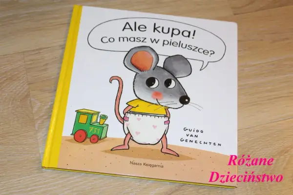 Okładka książki "Ale kupa! Co masz w pieluszce?" z myszką w pieluszce i pociągiem.